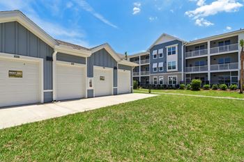 Private garages with apartment buildings behind